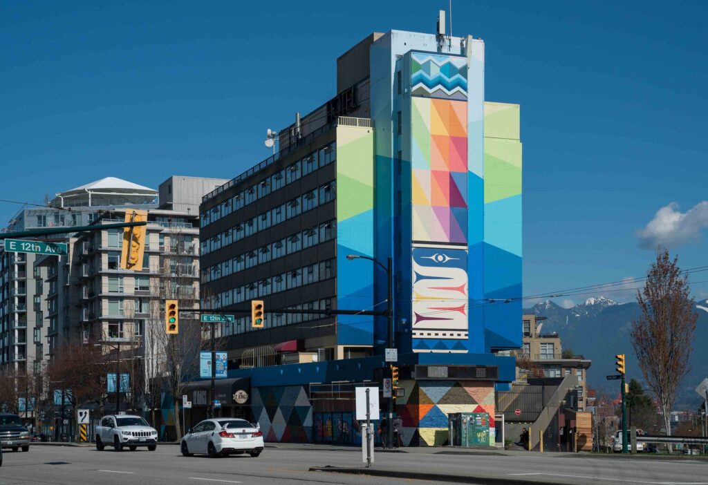 This image has an empty alt attribute; its file name is MuralArtistDebraSparrowspublicstreetartinstallationforVancouverMuralFestivalVMF-1024x702.jpg
Blanketing The City: A Mural Series. A Three Part Mural Series Celebrating Coast Salish WeavingDesigned by Debra Sparrow + Produced by The Vancouver Mural Festival