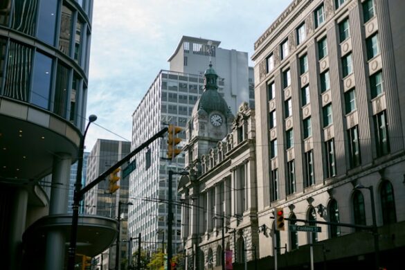 5 day trip vancouver. vancouver canada bc city tower light street modern glass cement tourist tourism clock historic cloudy cloud harsh sun twilight america