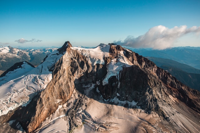 snow covered mountain under blue sky during daytimee. 5 day trip vancouver.  whistler
canada
columbia britannica
mountain
nature
snow
landscape
glacier
moutains
rocky
explore
sunset
winter
areal
outdoors
mountain range
peak
ice
scenery
panoramic